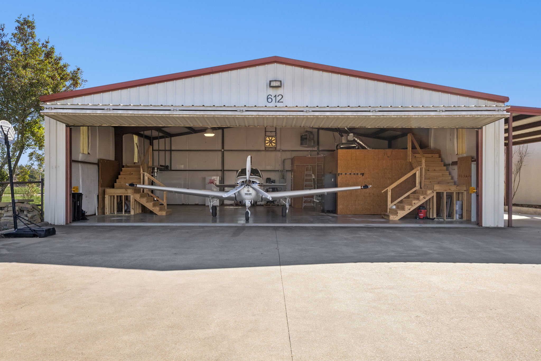 Mediterranean-style residence with a separate aircraft hangar
